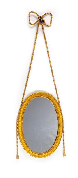 null Gilt bronze mirror with molded frame held by a tie simulating a rope topped...