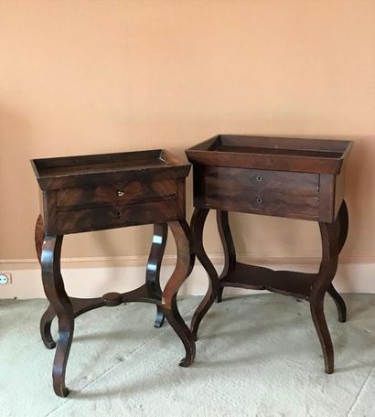 null Two bedside tables that can form a pair in mahogany and mahogany veneer. They...