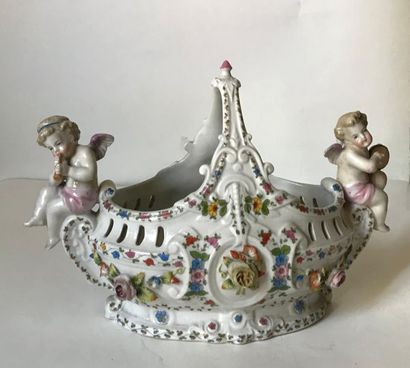null Polychrome porcelain basket decorated with musician cherubs in relief
Mark under...