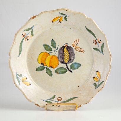 NEVERS NEVERS

Earthenware plate decorated with fruit and pomegranate. 19th century

D....