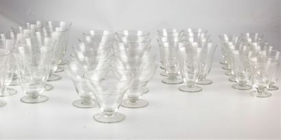 null Part of a service of crystal glasses with engraved decoration of lily of the...