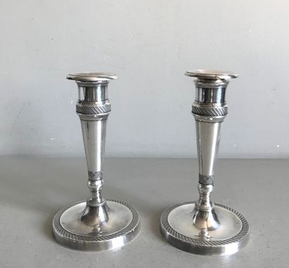 null Pair of small tapered candlesticks in silver plated bronze with fluted friezes....