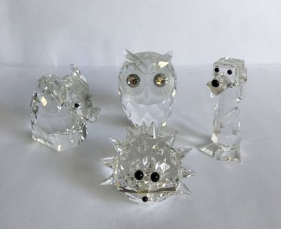 SWAROVSKI SWAROVSKI

Four cut crystal trinkets in the shape of small animals.

H;...