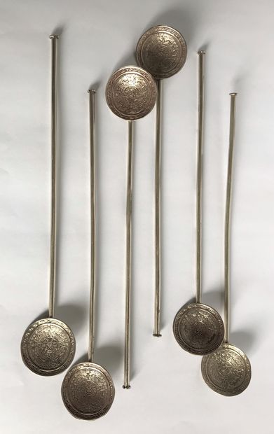 null Set of six silver cocktail spoons. The spoon chiseled with pre-Columbian motifs.

Hallmark...