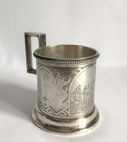 null A silver glass mug, moulded and chiselled with a frieze of pearls and engraved...