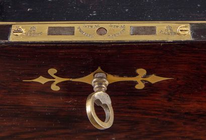 null Mahogany and brass inlay marine writing case. It opens to reveal a leather-covered...