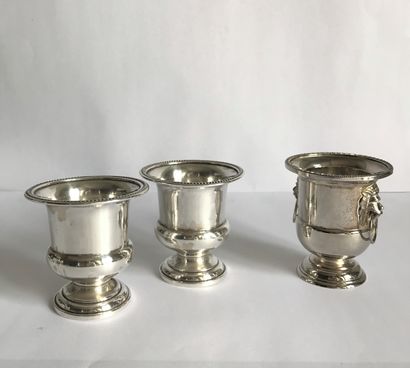 null Pair of small Medici vase shaped table planters in sterling silver.

Probably...