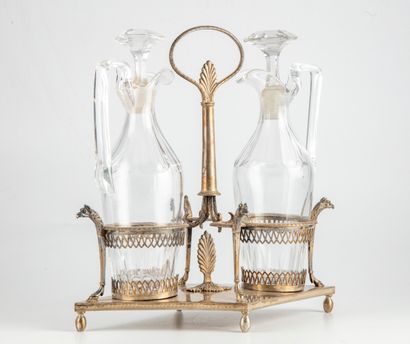 null Oil and vinegar holder in silver. Early 19th century

H. 28 cm ; L. 27 cm

Bottles...