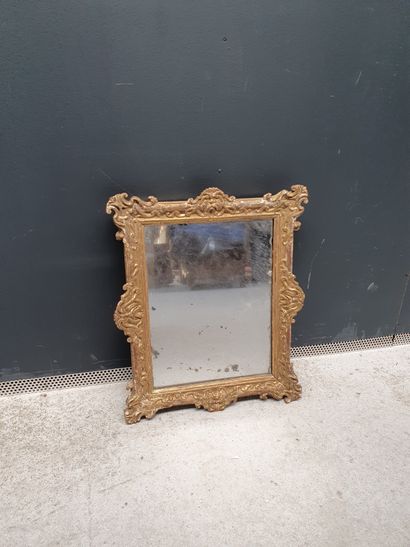 null Rectangular mirror in wood and gilded stucco chased with leaves. Mercury mirror...