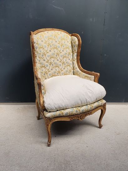 null A gilded wood "ear" shepherd's chair, moulded and chiselled with a ribboned...