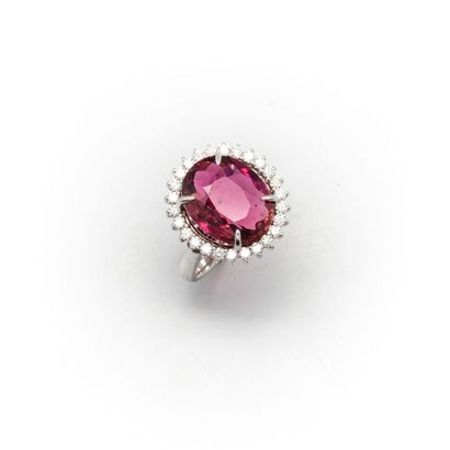null 18k white gold ring set with a pinkish red rubellite tourmaline weighing 11.6...