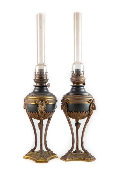 null Pair of oil lamps in metal with double patina in the shape of an Athenian resting...