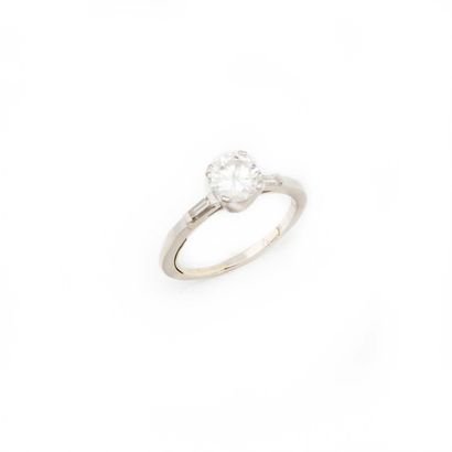 null Platinum ring set with a solitaire diamond weighing approximately 0.97 carat,...