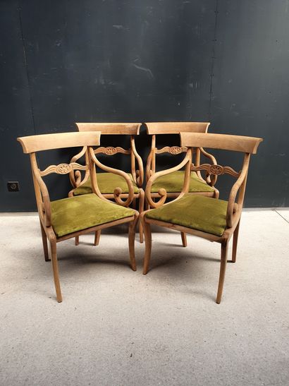 null Four wood armchairs in natural wood (not patinated). Velvet seat cushion.

English...