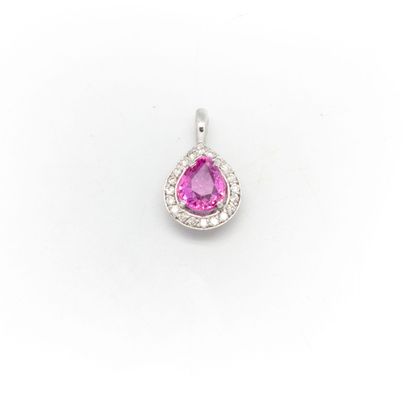null 18k white gold pendant set with a pink sapphire weighing 1.07 ct. surrounded...