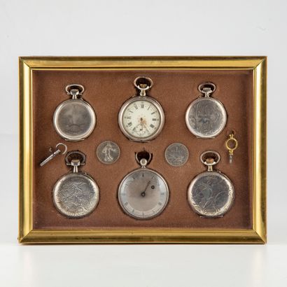 null A frame containing 6 metal and silver pocket watches 

In this frame and joined...