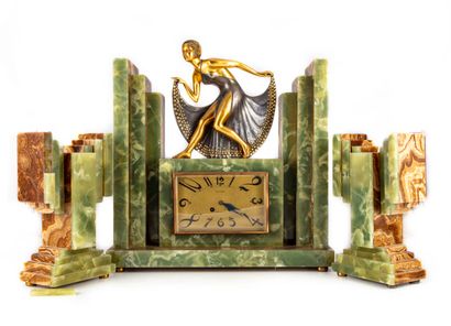 null Marble slab mantel set. It is composed of a clock decorated with a statuette...