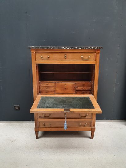 null Louis XVI style natural wood secretary with flap. It opens with a drawer in...