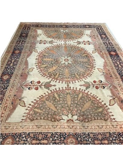 null Large Persian carpet decorated with a central medallion and two half-medallions...