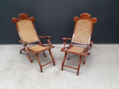 null Pair of folding planter armchairs with exotic wood structure and cane uphol...