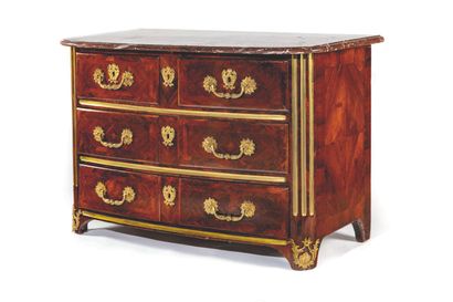 null 
Rosewood chest of drawers, the curved front opening to four drawers on three...