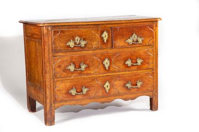 Moulded oak chest of drawers opening to four...