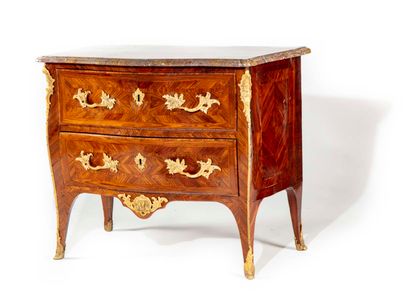 null A rosewood chest of drawers, opening with two drawers, the top of sarrancolin...