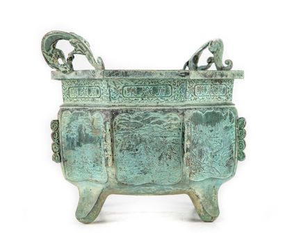 CHINE An octagonal pot cover with a japanese saynette design and a green patinated...