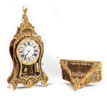 null A brown tortoiseshell and engraved brass wall-mounted cartel, decorated with...