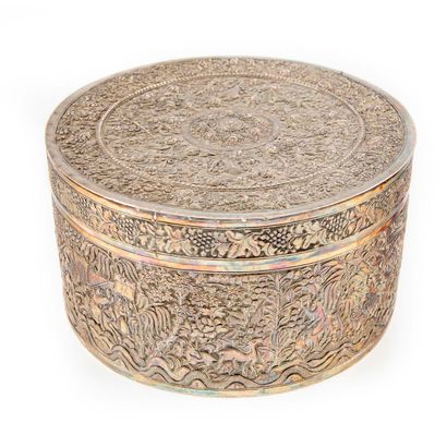 null Large round silver box with rotating decoration in relief of a scene with riders...