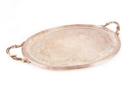 CHRISTOFLE CHRISTOFLE

Oval serving tray in silver plated metal, the bottom engraved...