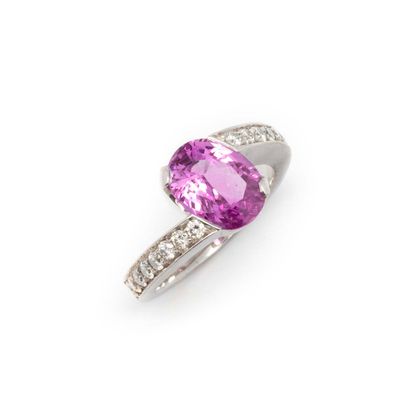 White gold ring set with a pink sapphire...