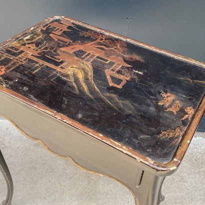 null Small blackened wood table decorated on the top with a scene in the taste of...