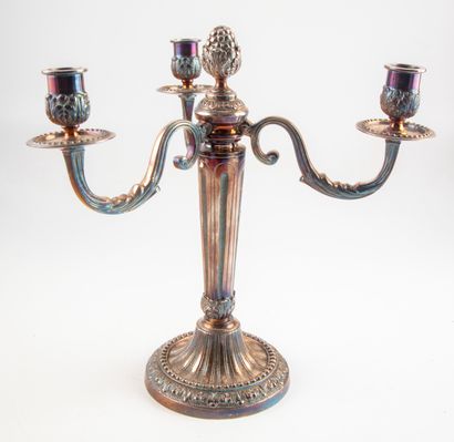null A three arms silvered bronze torch with moulded and chased leaves and flutes....