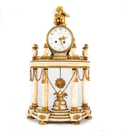 null Gilt bronze and white marble clock, the dial resting on an entablature with...