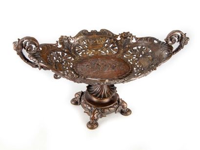 null Cup resting on a base with four small feet decorated with chimera heads, the...