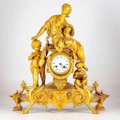 null Gilded clock with allegorical subject illustrating the Arts representing a woman...