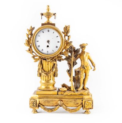 null Small ormolu clock "Au chasseur", the dial framed with laurel garlands and surmounted...
