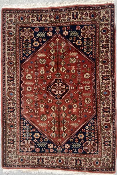 null Mechanical wool carpet, the field decorated with an ochre rhombus on a blue...