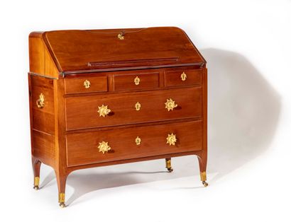 null A mahogany chest of drawers opening to four drawers and a flap revealing six...