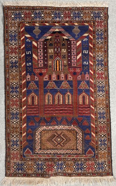 null Woolen prayer rug with geometric decoration on a red and blue background. Triple...