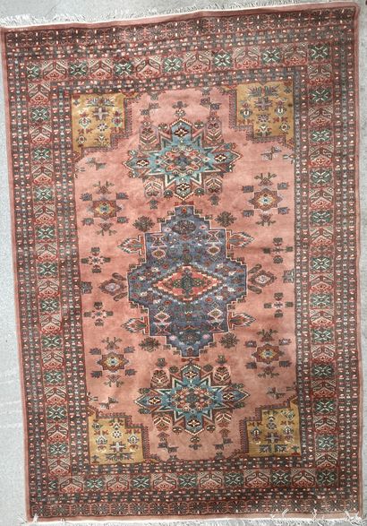 null Woolen carpet with geometric decoration on a pink background

282x187cm