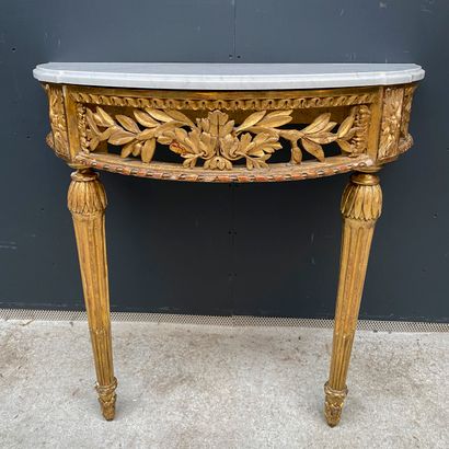 null Gilded wood half-moon console with carved and openworked foliage, the legs with...