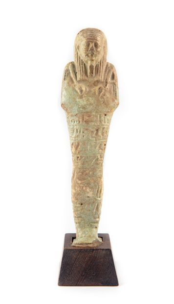 null Late Ushebti - its wooden base is attached

30th Dynasty

H. 21,5 cm