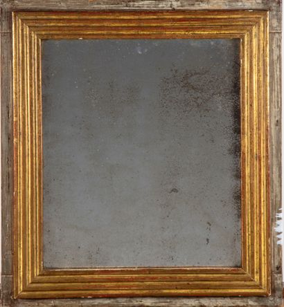 null A lacquered wood mirror with gilded frame mouldings. 18th century style