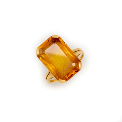 Yellow gold ring set with an emerald-cut...