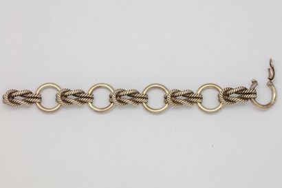 HERMES HERMES - Paris 
Bracelet en argent articulé à décor de cercles et de noeuds...