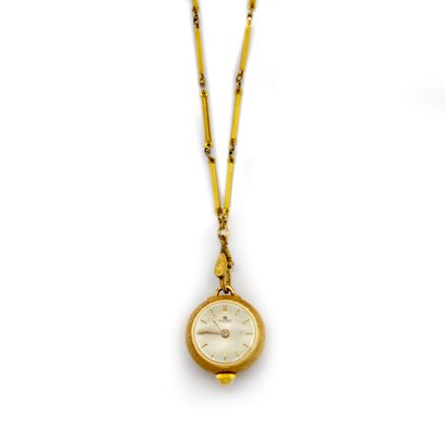 BUCHERER BUCHERER House 
Ball-shaped pendant watch in 14K Amati gold, with a gilded...