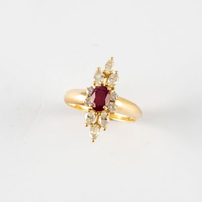  Yellow gold ring set with a ruby surrounded by navette and round diamonds in a staggered...