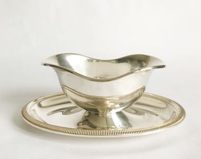 CHRISTOFLE CHRISTOFLE

Sauce boat on its silver plated metal frame with a fluted...